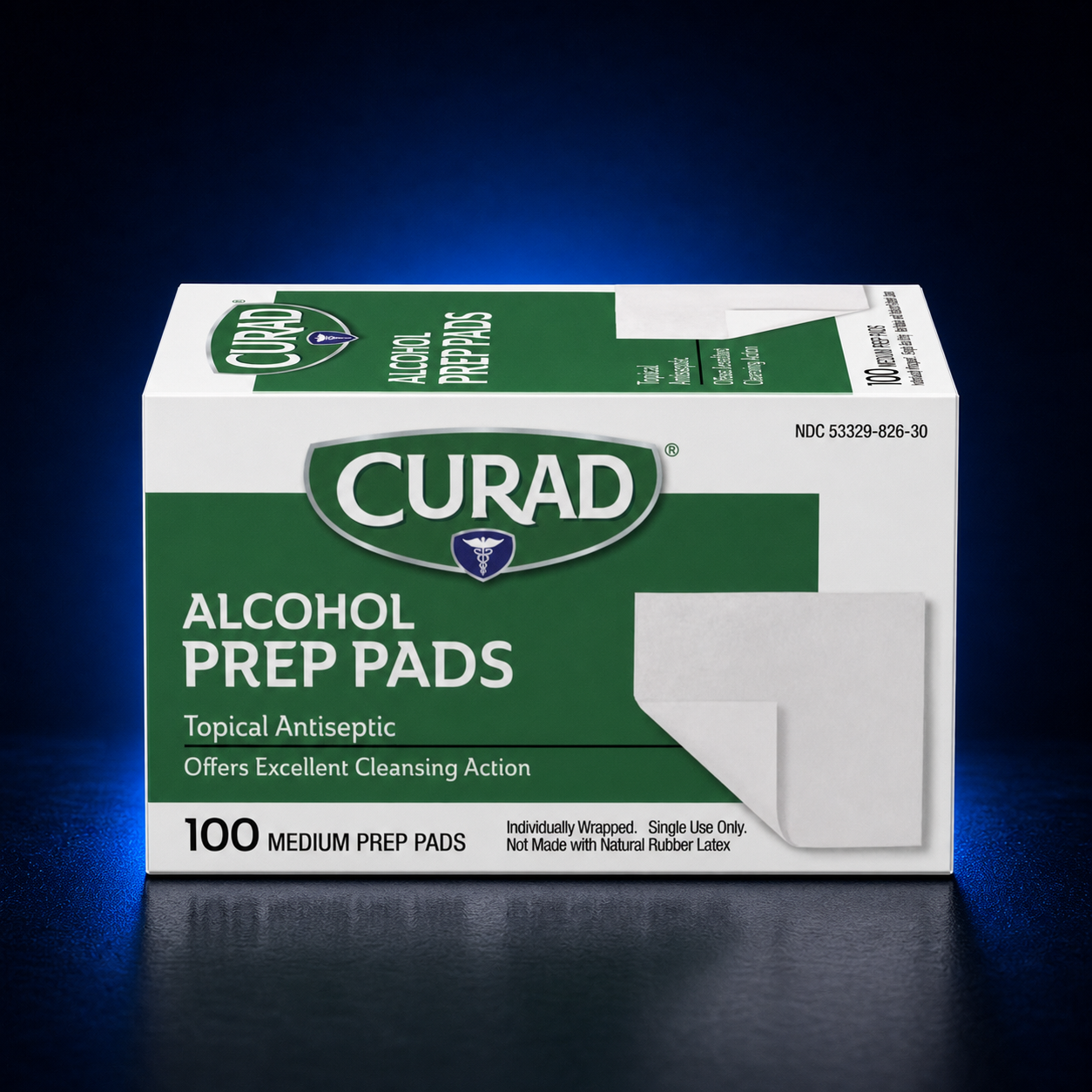 Curad Alcohol Prep Pads, box of 100 medium individually wrapped prep pads on a dark blue studio background